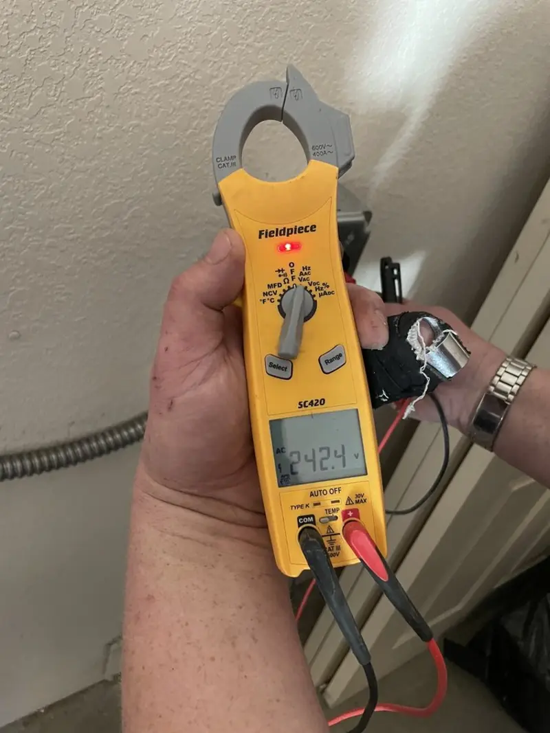 Voltage testing with clamp meter during Generator Installation in Maugansville